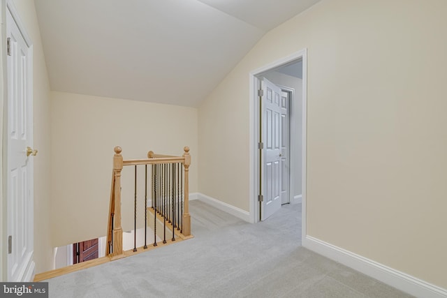 additional living space with carpet flooring and lofted ceiling