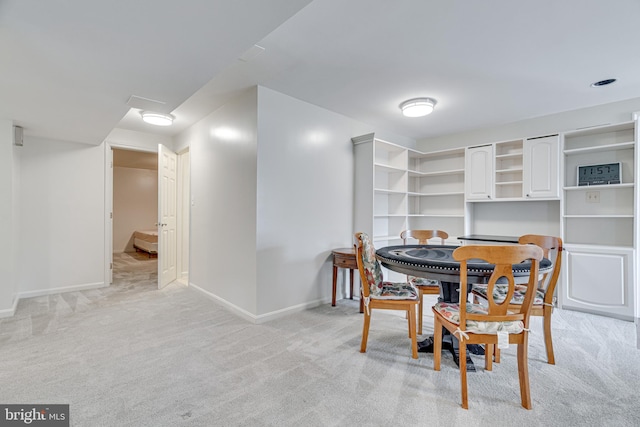 dining room with light carpet