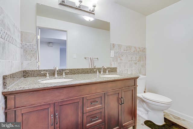 bathroom featuring tile walls, tile patterned flooring, vanity, and toilet