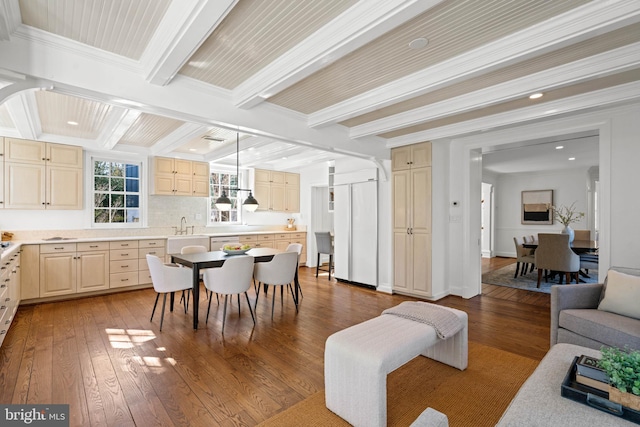 interior space featuring hardwood / wood-style flooring, crown molding, baseboards, and beamed ceiling