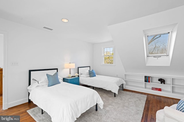 bedroom featuring recessed lighting, visible vents, baseboards, and wood finished floors