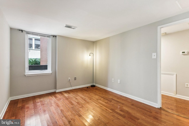 spare room featuring light wood-type flooring