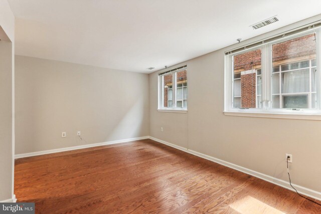 interior space featuring a high ceiling and brick wall