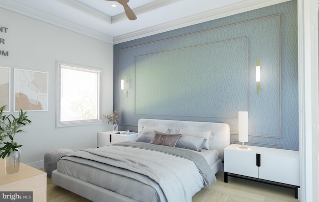 bedroom with a raised ceiling, ornamental molding, wood-type flooring, and ceiling fan