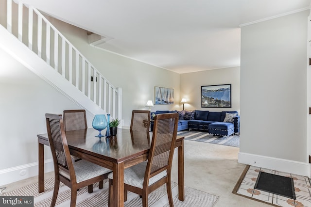 dining area featuring crown molding