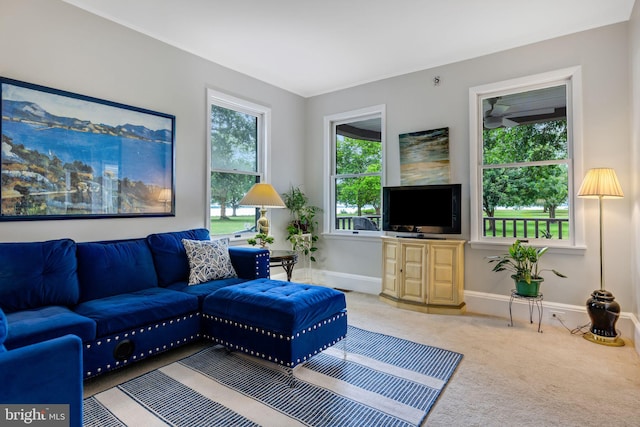 living room with light colored carpet and a healthy amount of sunlight