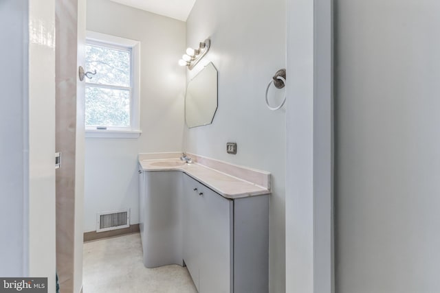 bathroom featuring vanity and concrete floors