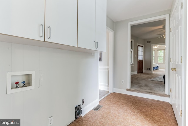 clothes washing area with light carpet, hookup for a washing machine, cabinets, and ceiling fan