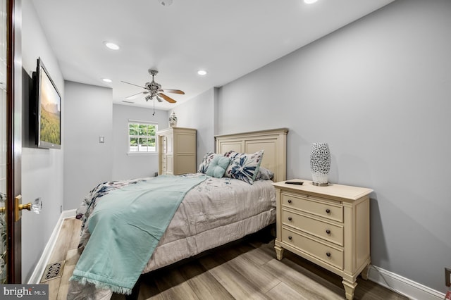 bedroom featuring ceiling fan and light wood-type flooring