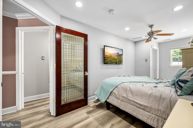 bedroom with light hardwood / wood-style flooring and ceiling fan