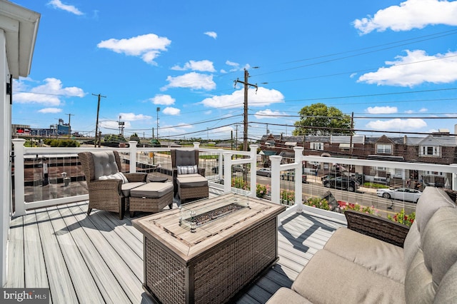 wooden deck featuring a fire pit