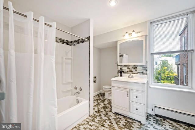 full bathroom with backsplash, vanity, a baseboard heating unit, tile patterned flooring, and toilet