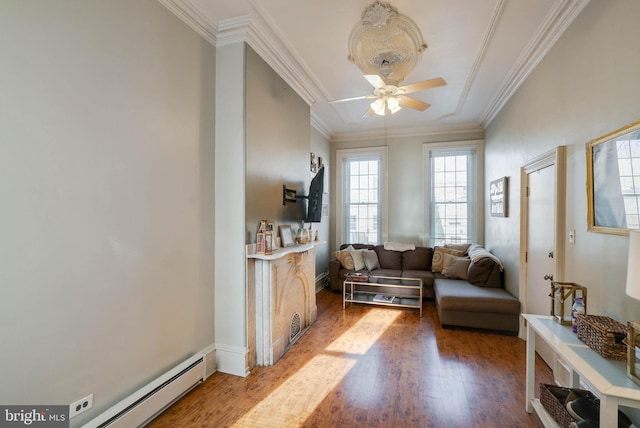 living area with hardwood / wood-style flooring, crown molding, and ceiling fan