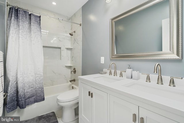 full bathroom featuring toilet, dual bowl vanity, and shower / bath combo