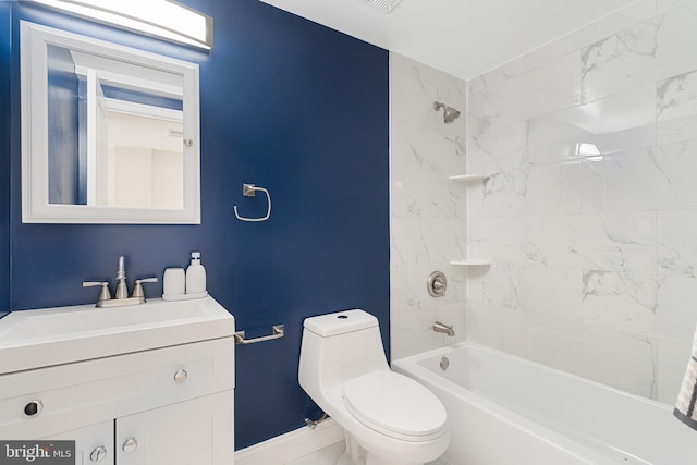 full bathroom with tiled shower / bath, toilet, and vanity