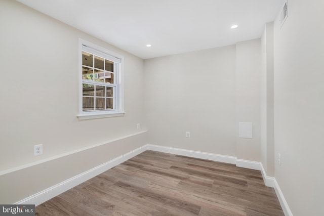 empty room featuring hardwood / wood-style flooring