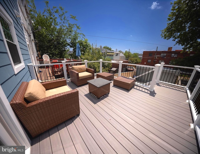 wooden terrace featuring outdoor lounge area