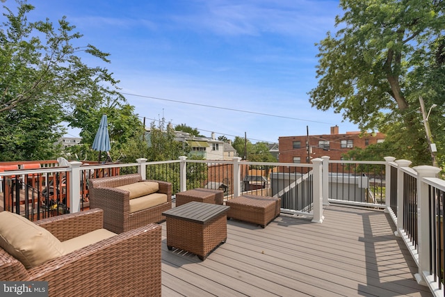 wooden deck with an outdoor living space