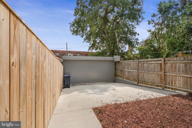 view of yard featuring fence and a patio