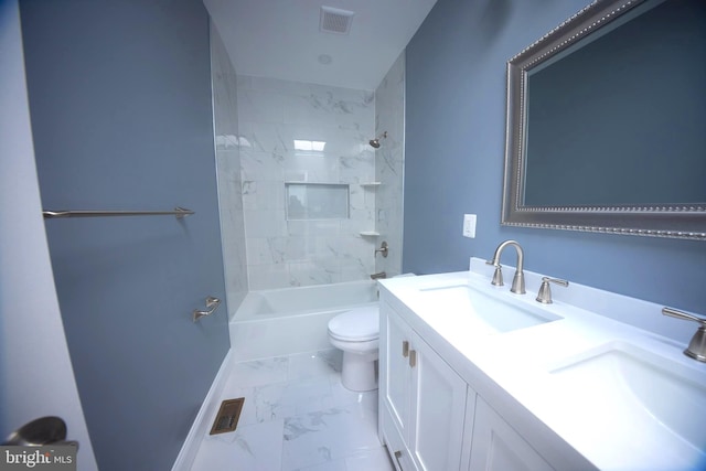 full bathroom featuring tile patterned flooring, dual bowl vanity, tiled shower / bath combo, and toilet