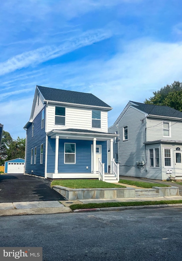 view of front of property featuring a garage and a porch