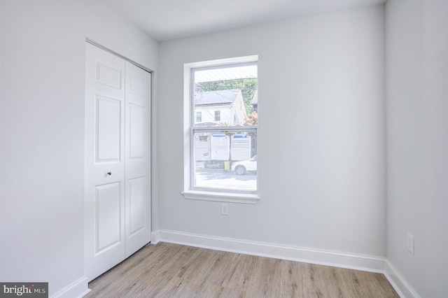 spare room featuring light hardwood / wood-style floors