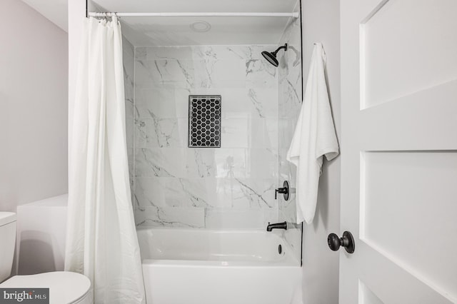 bathroom featuring toilet and shower / tub combo with curtain