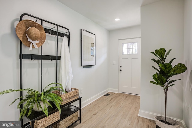 foyer with light wood-type flooring