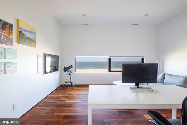 office space featuring visible vents and wood finished floors