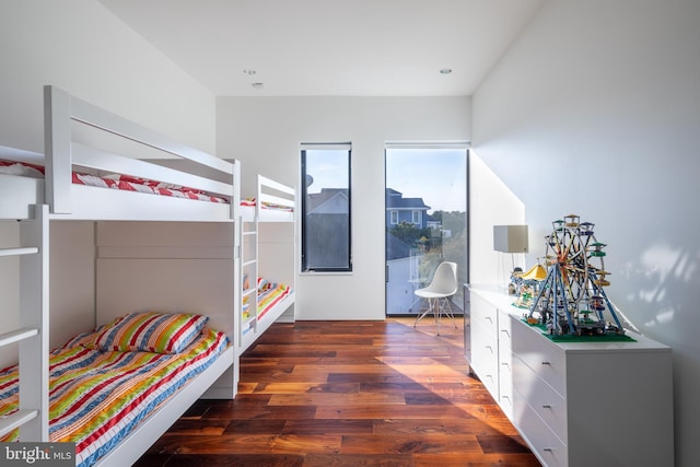 bedroom with wood finished floors and recessed lighting