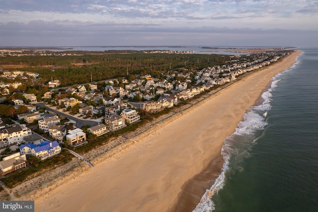 drone / aerial view with a view of the beach and a water view