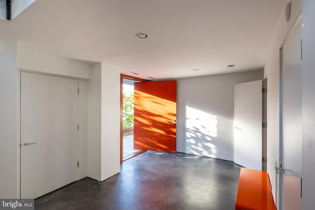 entrance foyer featuring recessed lighting and finished concrete flooring