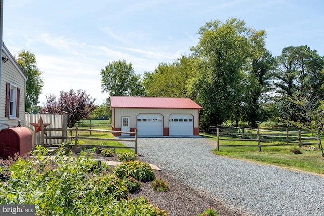 garage featuring a lawn