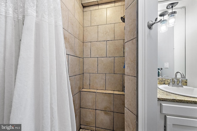 bathroom with vanity and curtained shower