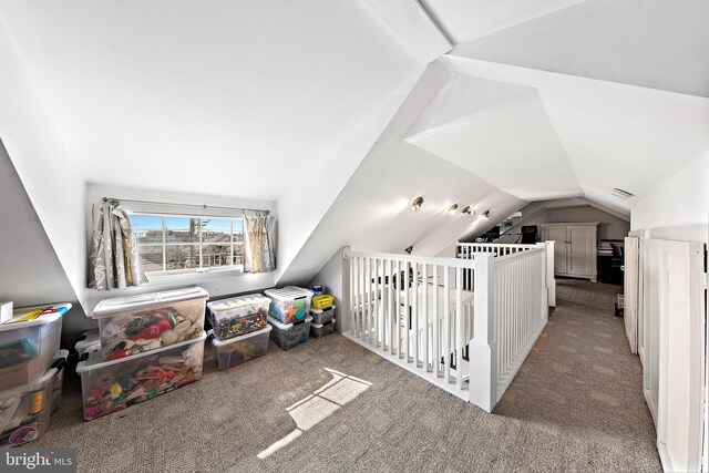 bonus room featuring lofted ceiling and light carpet