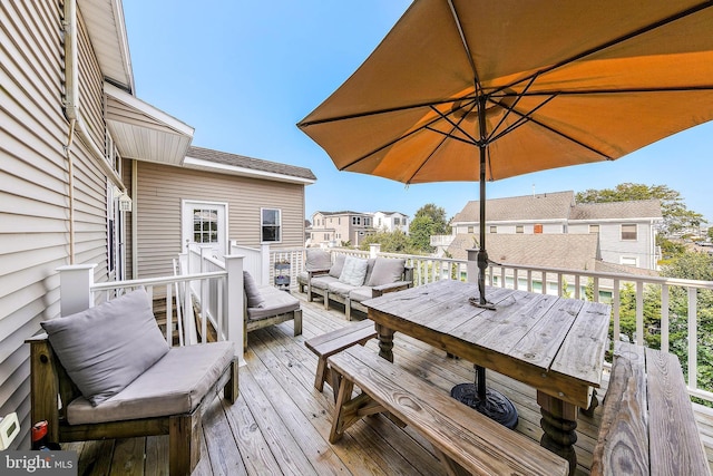 wooden deck with an outdoor hangout area