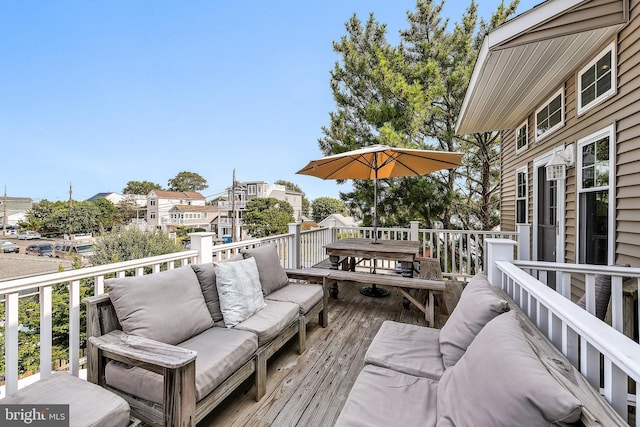 deck featuring outdoor lounge area