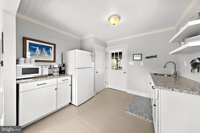 kitchen with white cabinetry, ornamental molding, sink, stone countertops, and white appliances