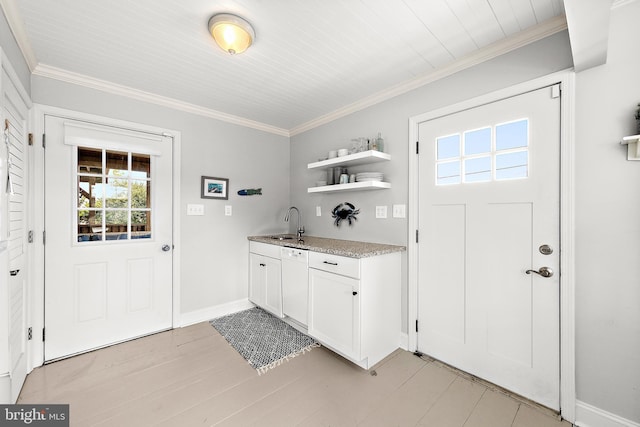 interior space featuring sink and crown molding