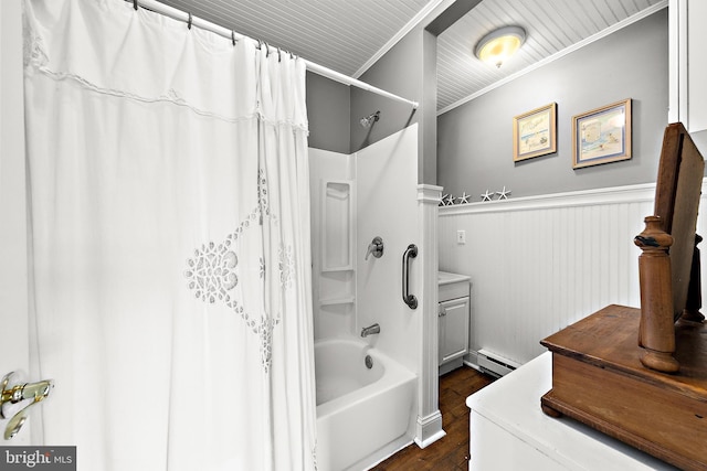 bathroom with hardwood / wood-style floors, ornamental molding, baseboard heating, and shower / bathtub combination with curtain