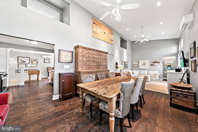 dining area featuring ceiling fan, high vaulted ceiling, dark wood-type flooring, and a wall mounted AC