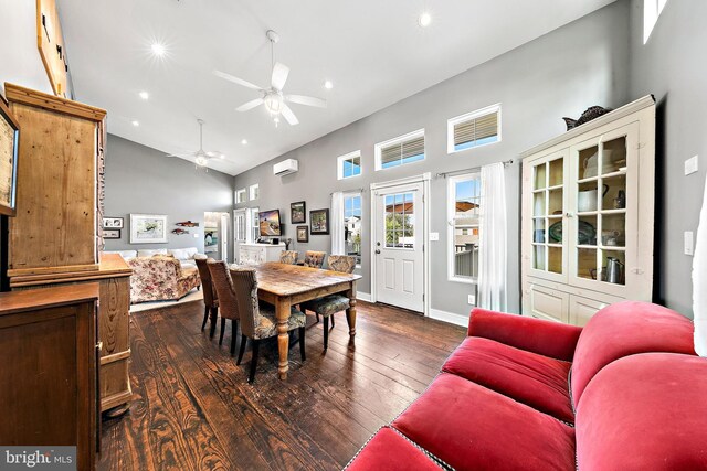 dining room featuring ceiling fan, high vaulted ceiling, a wall mounted AC, and dark hardwood / wood-style floors