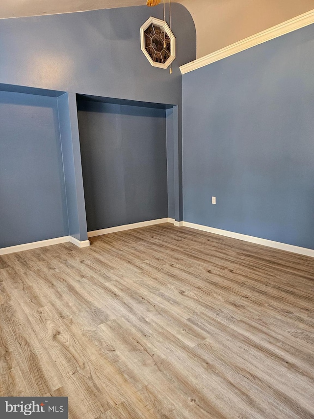 unfurnished room with hardwood / wood-style floors