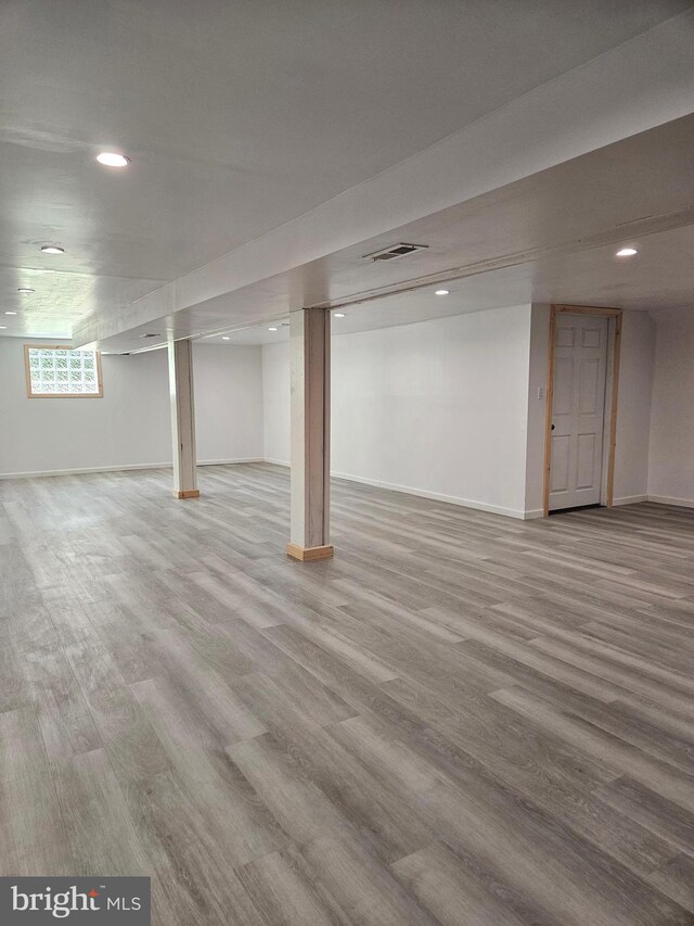 basement featuring hardwood / wood-style floors