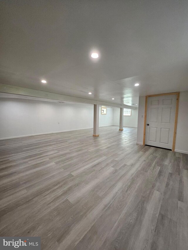 basement featuring hardwood / wood-style floors