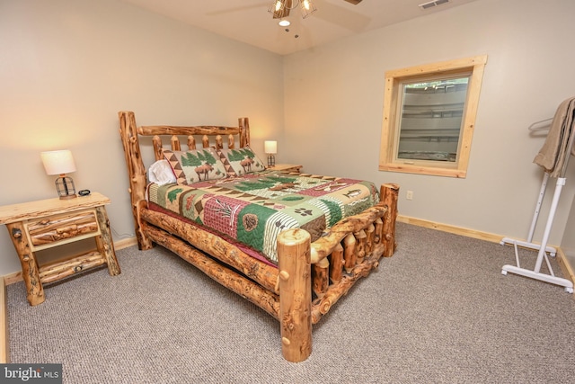 bedroom featuring carpet floors, a ceiling fan, visible vents, and baseboards