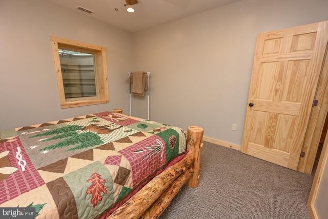 bedroom with baseboards, visible vents, dark colored carpet, and recessed lighting