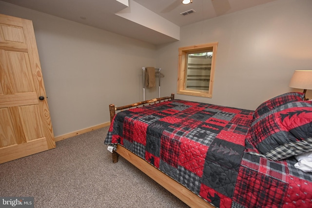 carpeted bedroom with visible vents and baseboards