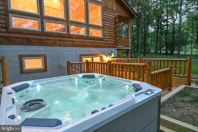 deck featuring a hot tub