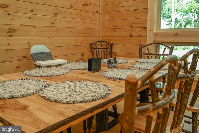 dining area with wooden walls